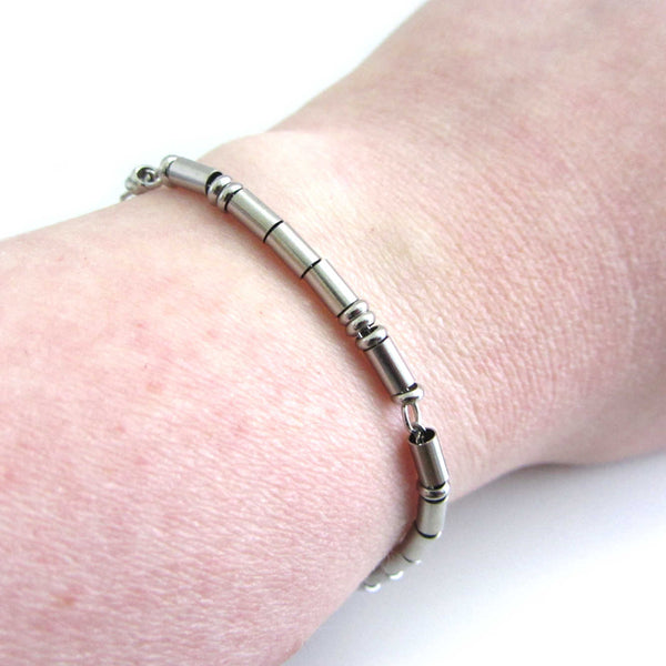 'I love you' stainless steel morse code bracelet worn on wrist for wearer to read