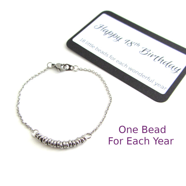 one stainless steel bead for each year bracelet on a stainless steel chain with happy birthday message card