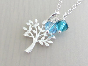 silver tree charm with coloured crystals on a silver chain
