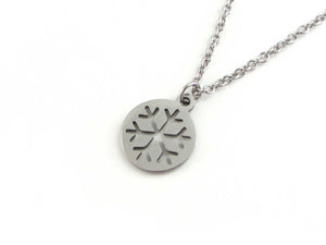 cut out snowflake charm on a stainless steel chain