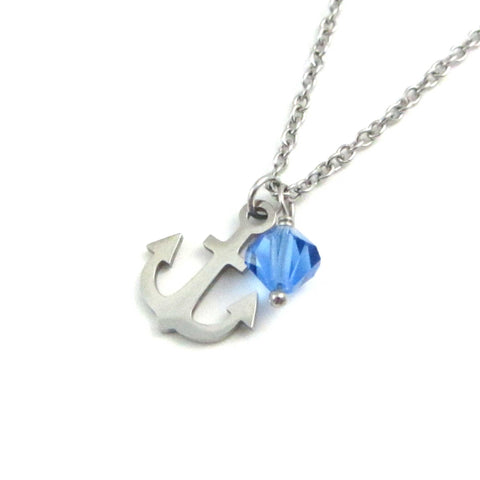 nautical anchor charm and a blue crystal charm on a stainless steel chain