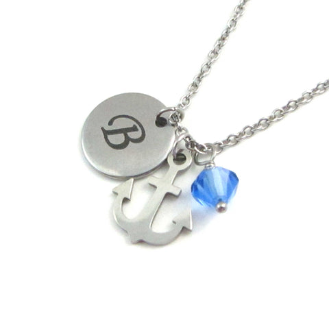 laser engraved capital initial letter disc charm, nautical anchor charm and a blue crystal charm on a stainless steel chain