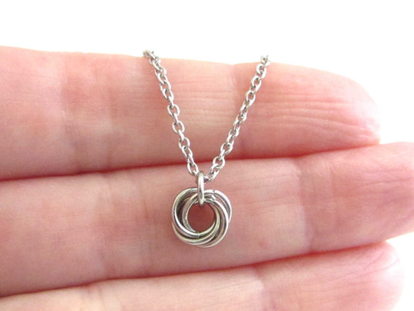 tiny linked rings chainmaille mobius ball on a stainless steel chain