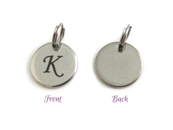 stainless steel disc charm front has letter, back is plain