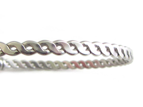 stainless steel bangle close up of braided twist pattern