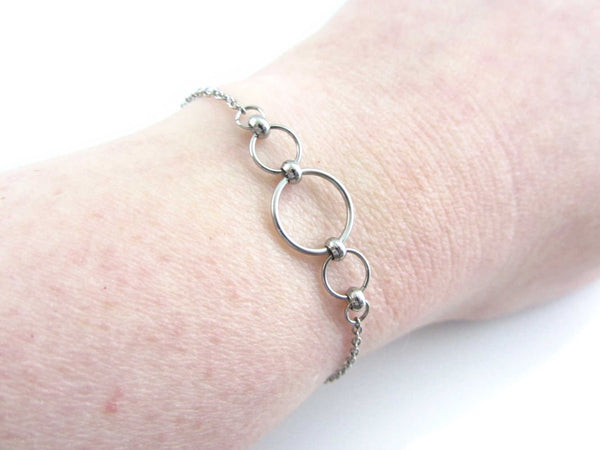 stainless steel beaded chainmaille linked circles bracelet on wrist