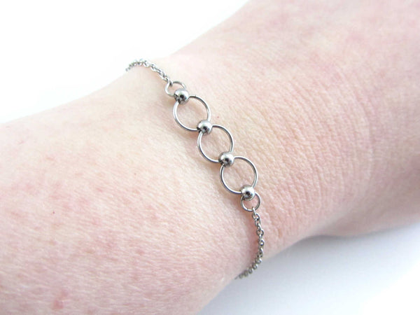 stainless steel beaded chainmaille linked circle rings bracelet on wrist