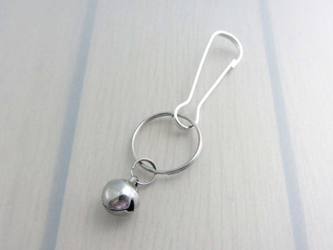 stainless steel bell charm on a bag charm with snap clip hook