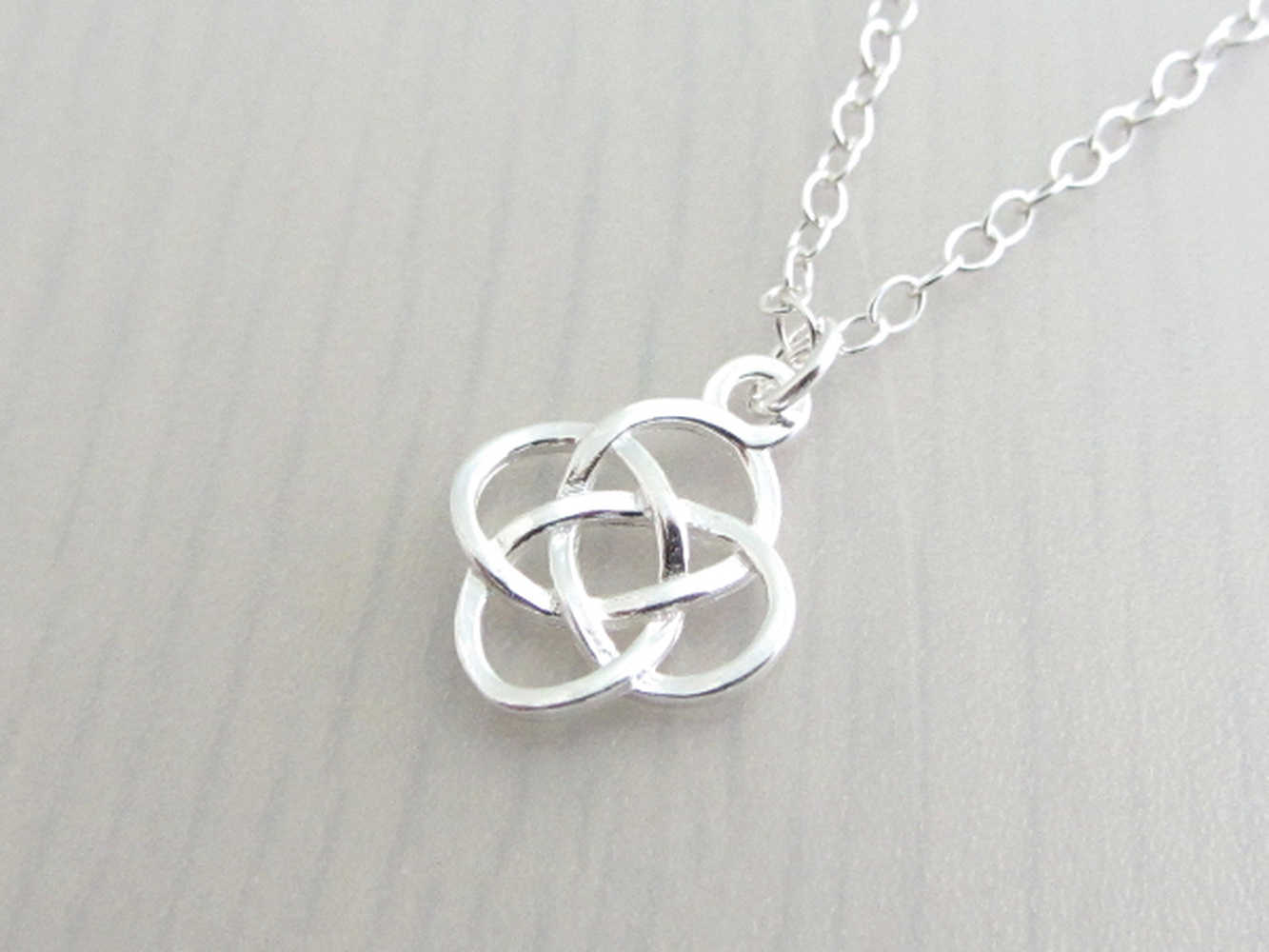 silver celtic knot charm on a silver chain