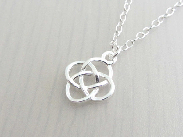 silver celtic knot charm on a silver chain