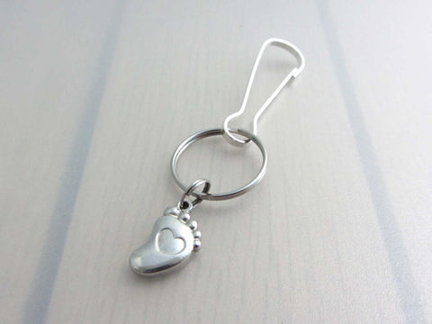 stainless steel single foot charm with indented heart on a bag charm with snap clip hook