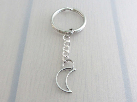 stainless steel hollow crescent moon charm on a chain keyring