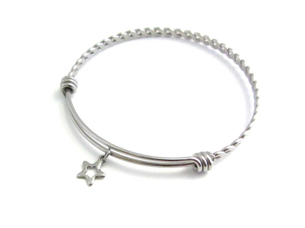 stainless steel hollow star charm on a bangle with braided twist pattern