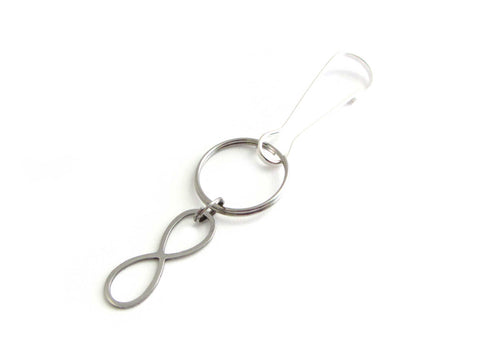 stainless steel infinity charm on a bag charm with snap clip hook
