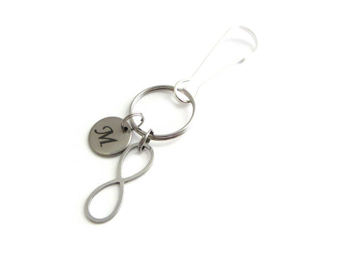 stainless steel laser engraved capital initial letter disc charm and infinity charm on a bag charm with snap clip hook