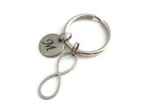 laser engraved capital initial letter disc charm and an infinity charm on a keyring