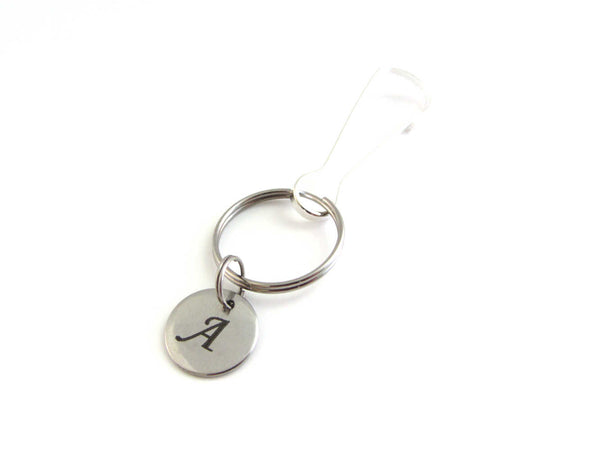 stainless steel laser engraved capital initial letter disc charm on a bag charm with snap clip hook