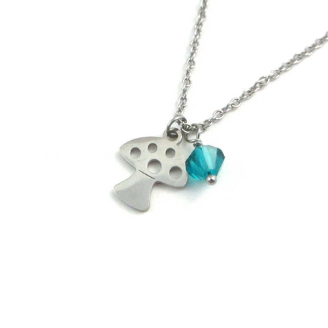 mushroom toadstool charm and a blue/green crystal charm on a stainless steel chain