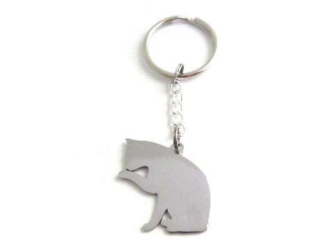 stainless steel pet cat sitting licking paw charm on a chain keyring