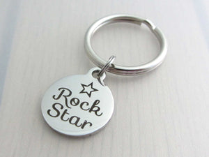 stainless steel laser engraved "rock star" with star charm on a keyring