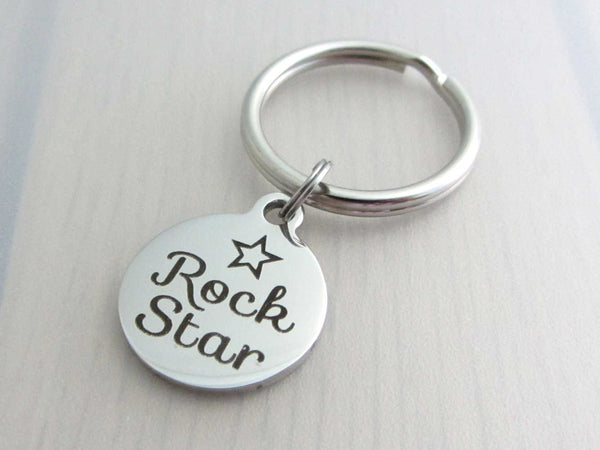 stainless steel laser engraved "rock star" with star charm on a keyring