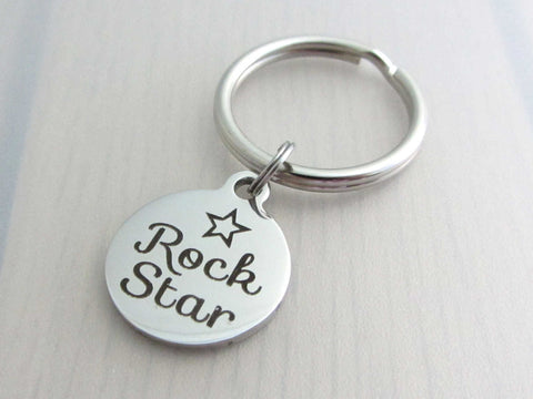 stainless steel laser engraved "rock star" with star charm on a keyring