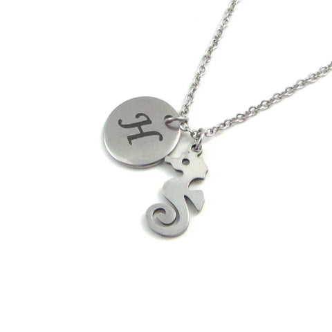 laser engraved capital initial letter disc charm and nautical seahorse charm on a stainless steel chain