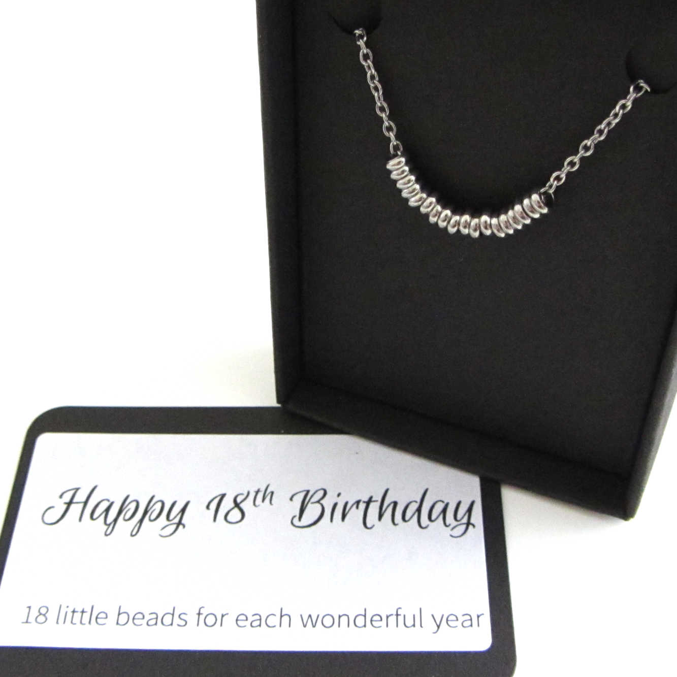 18 stainless steel beads one for each year necklace on a stainless steel chain shown in black gift box with happy 18th birthday message card