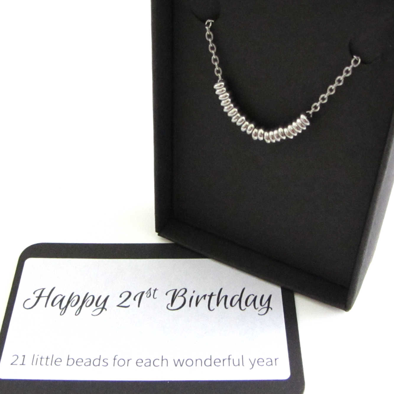 21 stainless steel beads one for each year necklace on a stainless steel chain shown in black gift box with happy 21st birthday message card