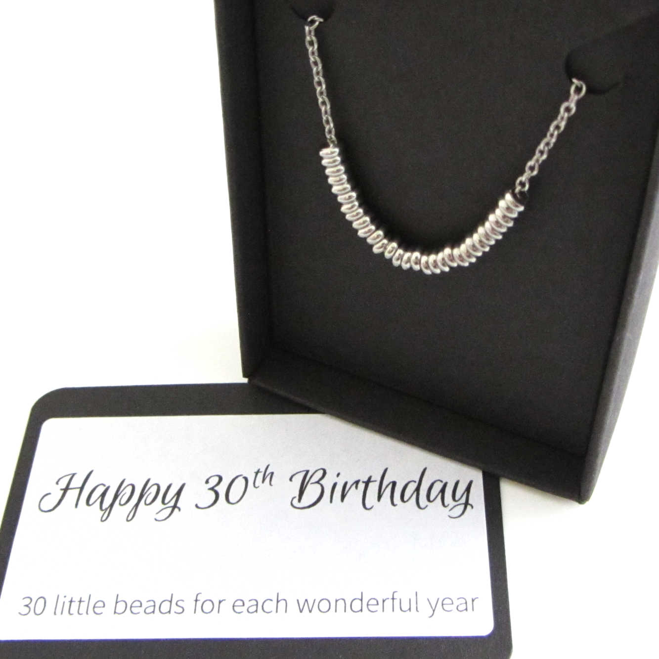 30 stainless steel beads one for each year necklace on a stainless steel chain shown in black gift box with happy 30th birthday message card