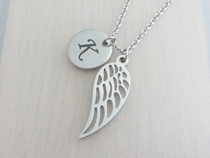 laser engraved capital initial letter disc charm and single angel wing charm on a stainless steel chain