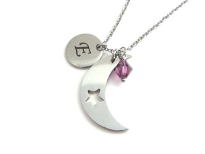 laser engraved capital initial letter disc charm, a crescent moon charm with cut out star and a purple crystal charm on a stainless steel chain