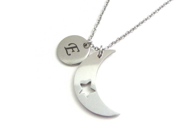 laser engraved capital initial letter disc charm and crescent moon charm with cut out star on a stainless steel chain