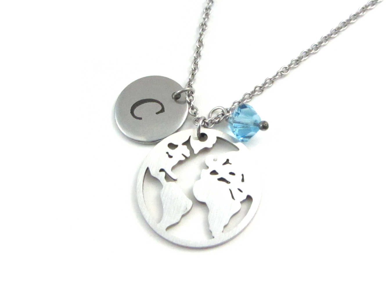 laser engraved capital initial letter disc charm, world globe earth map charm and a light blue crystal charm on a stainless steel chain