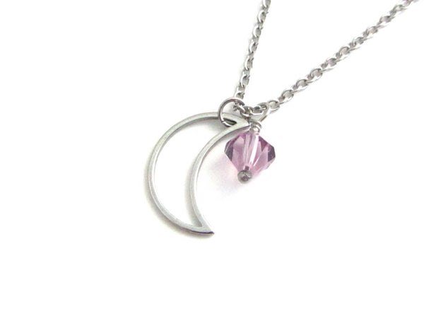 a hollow crescent moon charm and a light purple crystal charm on a stainless steel chain