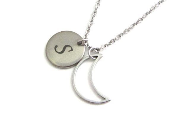 laser engraved capital initial letter disc charm and hollow crescent moon charm on a stainless steel chain