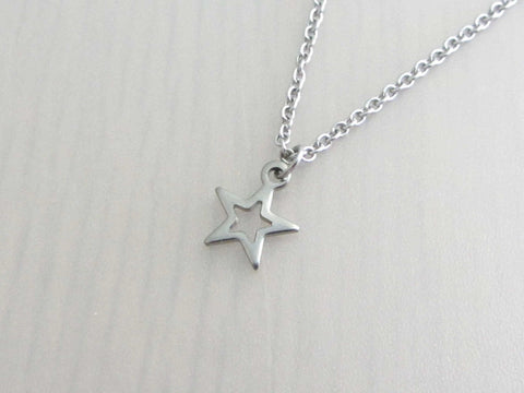 small hollow star charm on a stainless steel chain