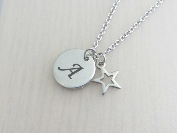 laser engraved capital initial letter disc charm and hollow star charm on a stainless steel chain