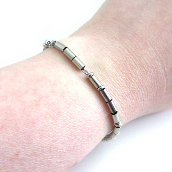 'I am enough' stainless steel morse code bracelet worn on wrist for wearer to read