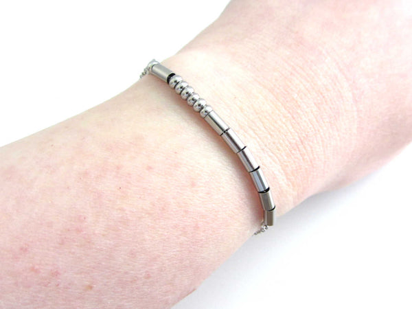 'mother' stainless steel morse code bracelet worn on wrist for others to read