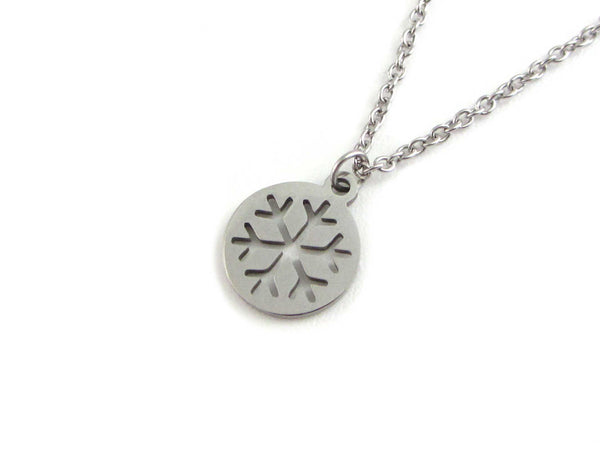 cut out snowflake charm on a stainless steel chain