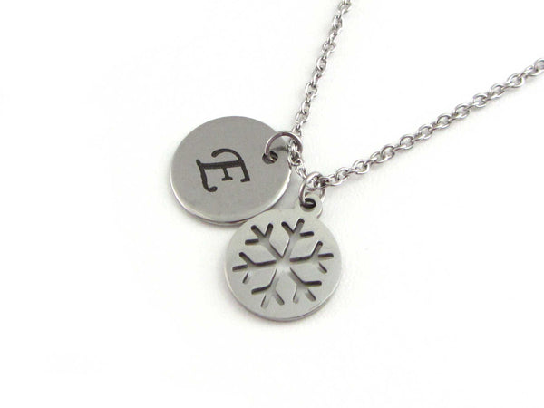 laser engraved capital initial letter disc charm and snowflake charm on a stainless steel chain