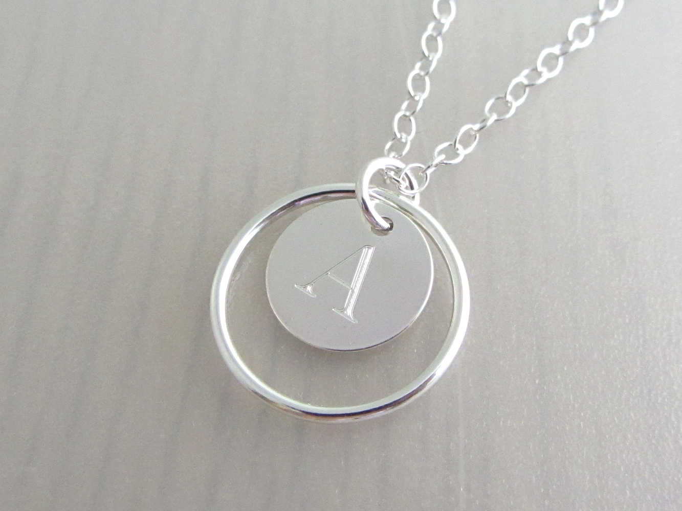 Silver circle pendant engraved deals