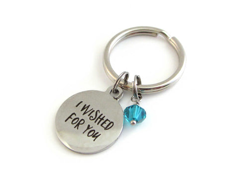 laser engraved "I wished for you" charm and a blue/green crystal charm on a keyring